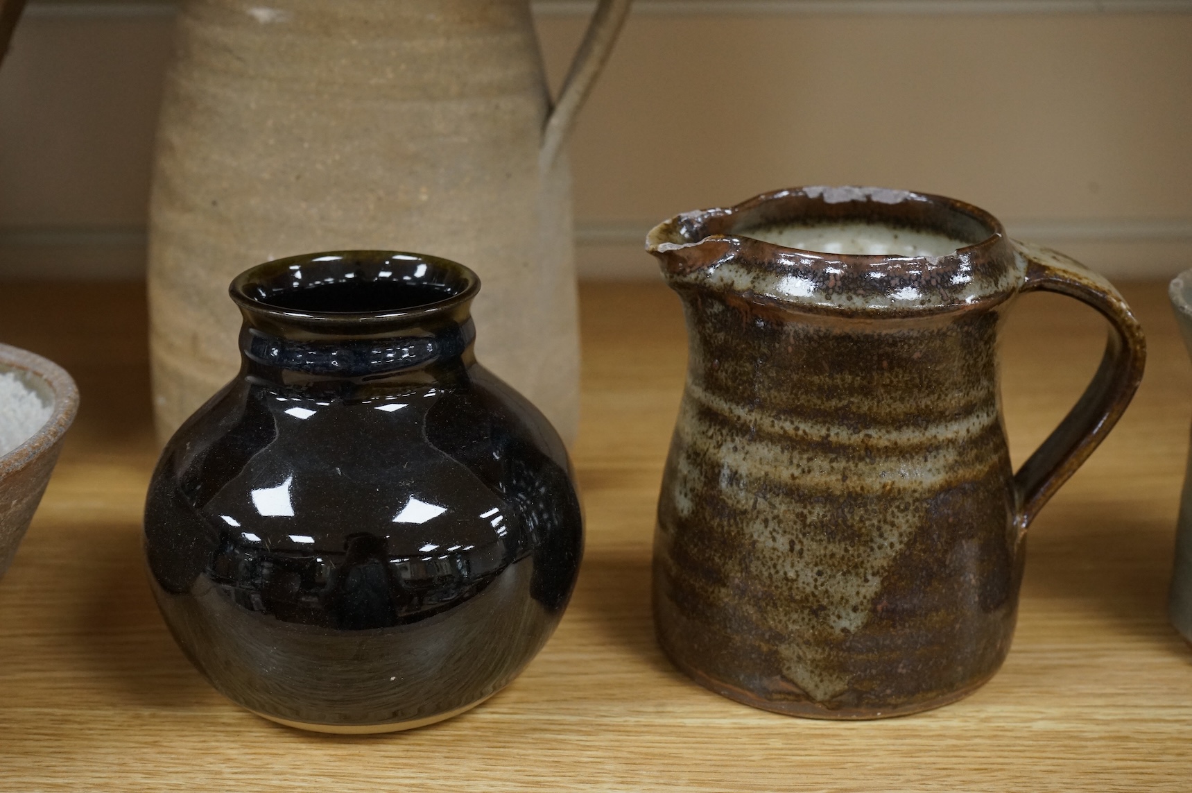 A group of Leach St. Ives pottery jugs and a pot and three other studio items of studio ceramics, some with impressed marks, largest 25cm high
